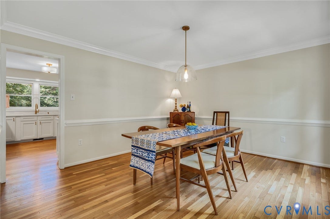 3704 Milbrier Place, Henrico, VA 23233 Hardwood flooring, crown molding, chair rail, and an overhead pendant light