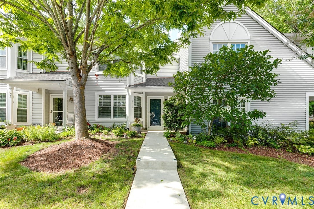 Welcome to 10815 Smithers Court where a landscaped path leads you to the covered front entry.