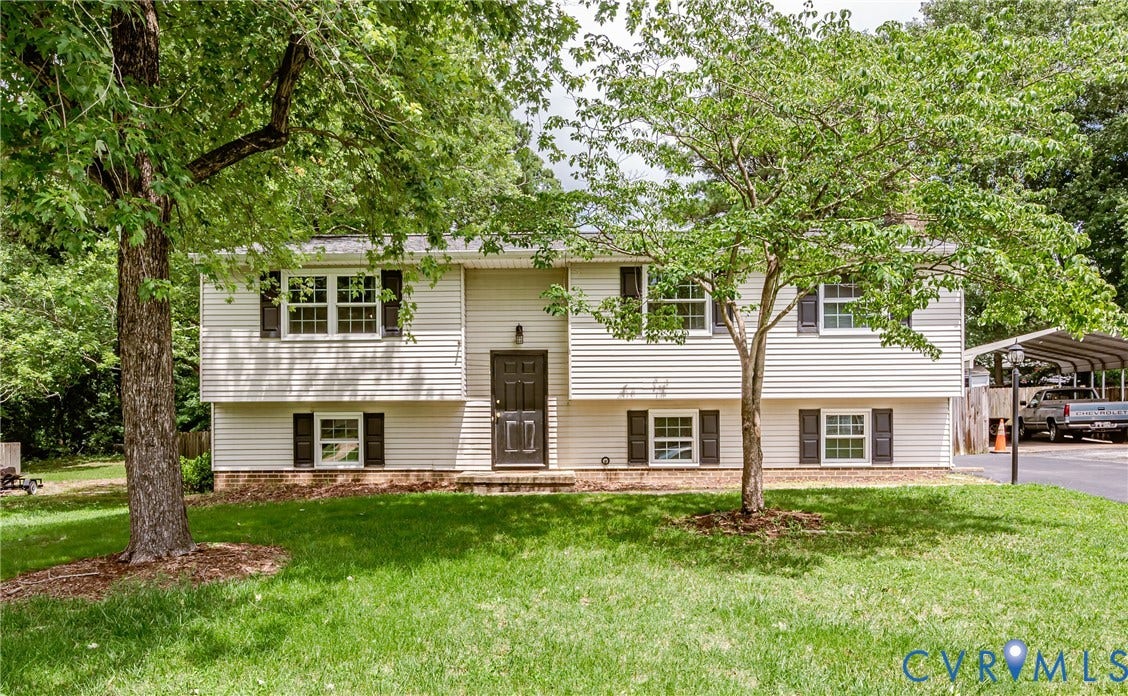 9406 Emmett Court, Glen Allen, VA 23060 Split-level residence featuring light-colored siding and dark shutters