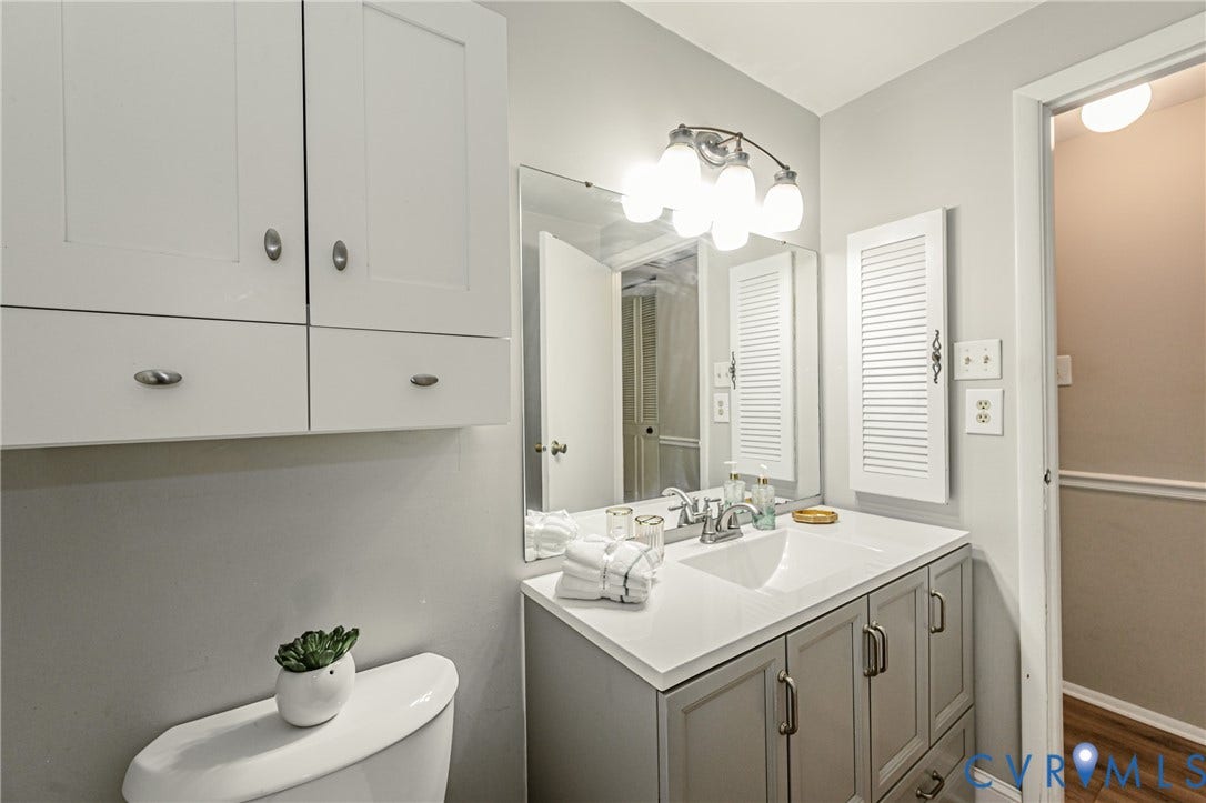 9406 Emmett Court, Glen Allen, VA 23060 Spa-inspired bathroom featuring a generous vanity with dual-sink configuration, soft-close cabinetry hardware, and a quartz countertop