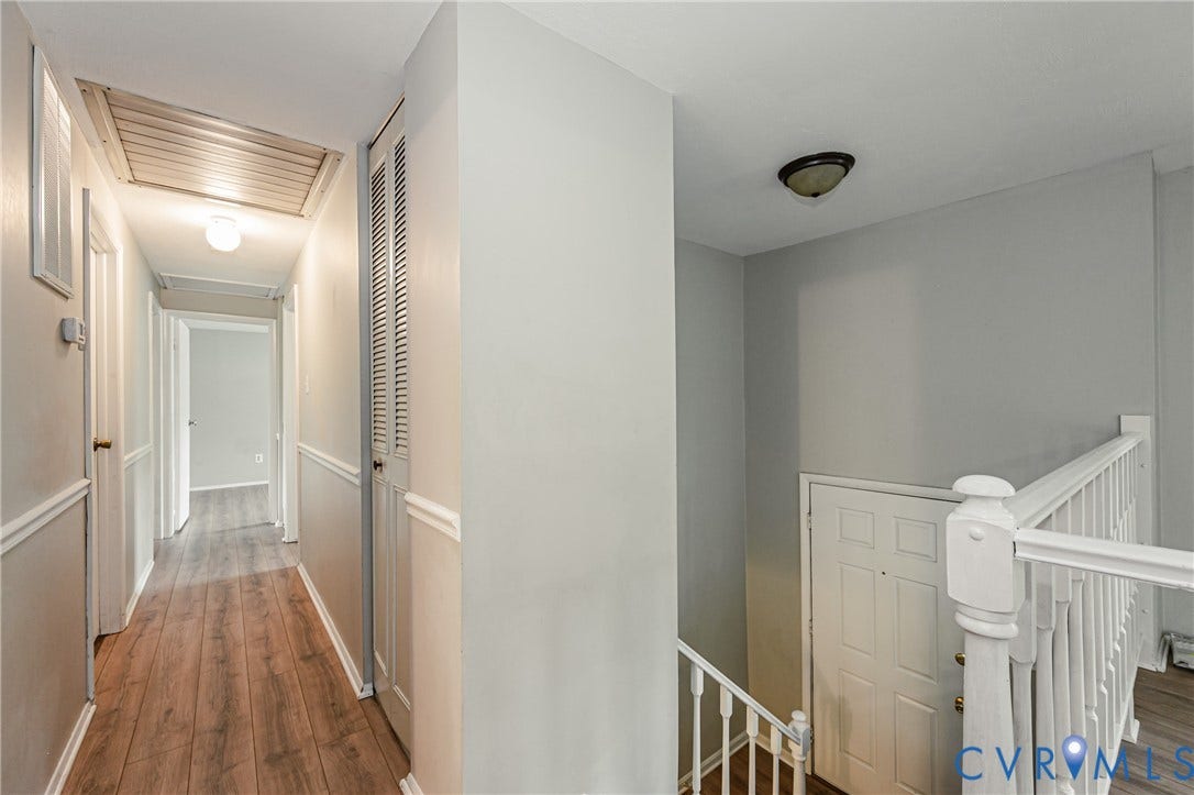 9406 Emmett Court, Glen Allen, VA 23060 Bright hallway with wood-finish flooring, white wainscoting, and recessed lighting