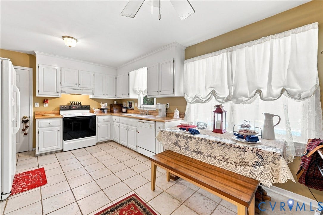 3819 Glen Oaks Court, Chester, VA 23831 Kitchen featuring white cabinetry, wood-finish countertops, and tile flooring