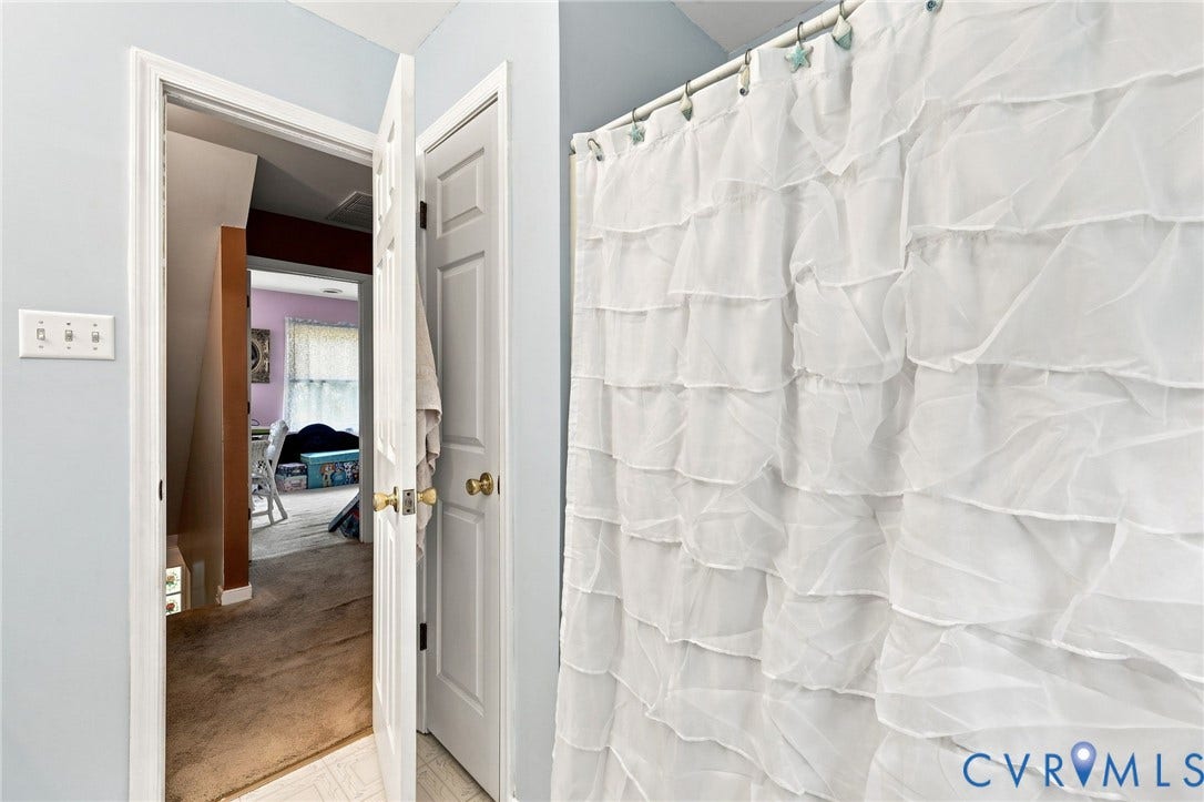 3819 Glen Oaks Court, Chester, VA 23831 Bathroom featuring light blue wall paint and white baseboards