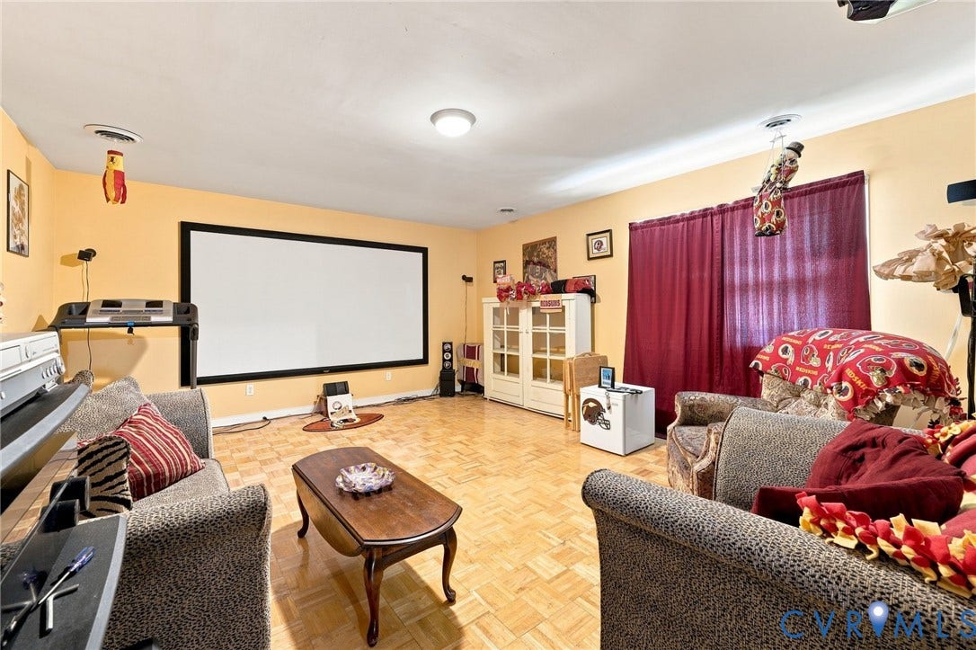 3819 Glen Oaks Court, Chester, VA 23831 Spacious room featuring a large projection screen, parquet flooring, and recessed lighting