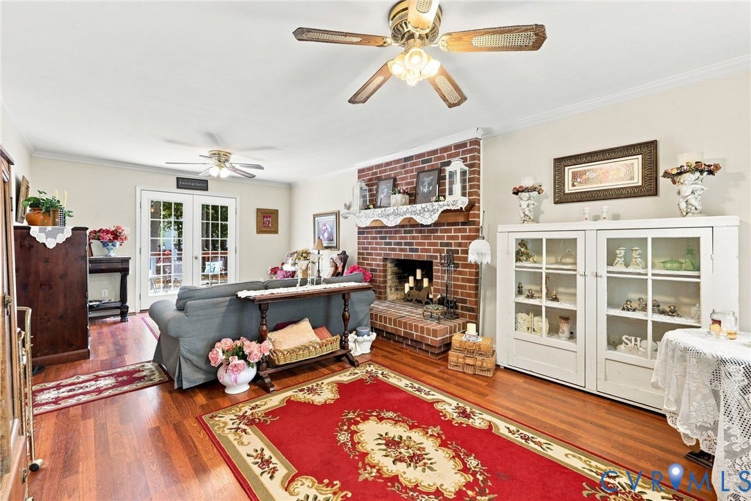 3819 Glen Oaks Court, Chester, VA 23831 Living space featuring wood flooring, a brick fireplace