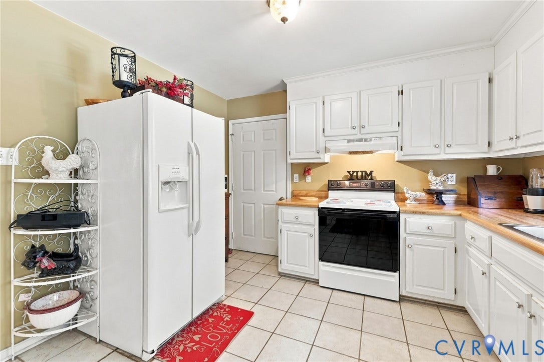 3819 Glen Oaks Court, Chester, VA 23831 Kitchen featuring white cabinetry with silver hardware, light wood-finish countertops, and square tile flooring