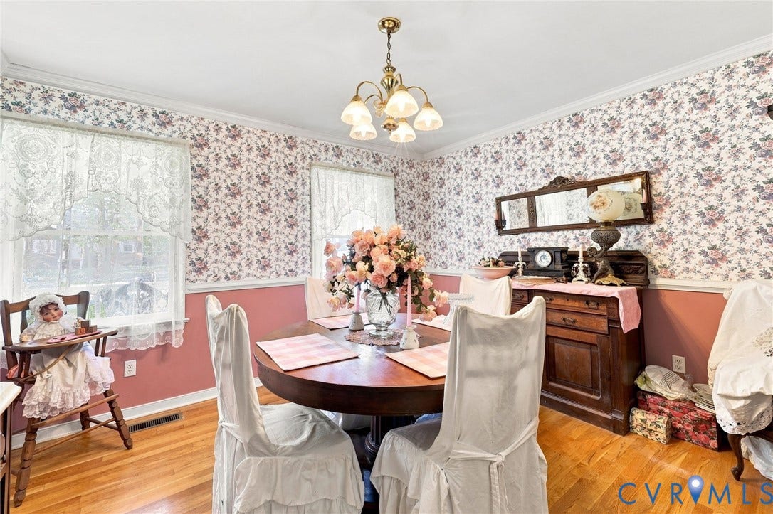 3819 Glen Oaks Court, Chester, VA 23831 Dining area featuring wood flooring, two large windows, crown molding, and a central chandelier