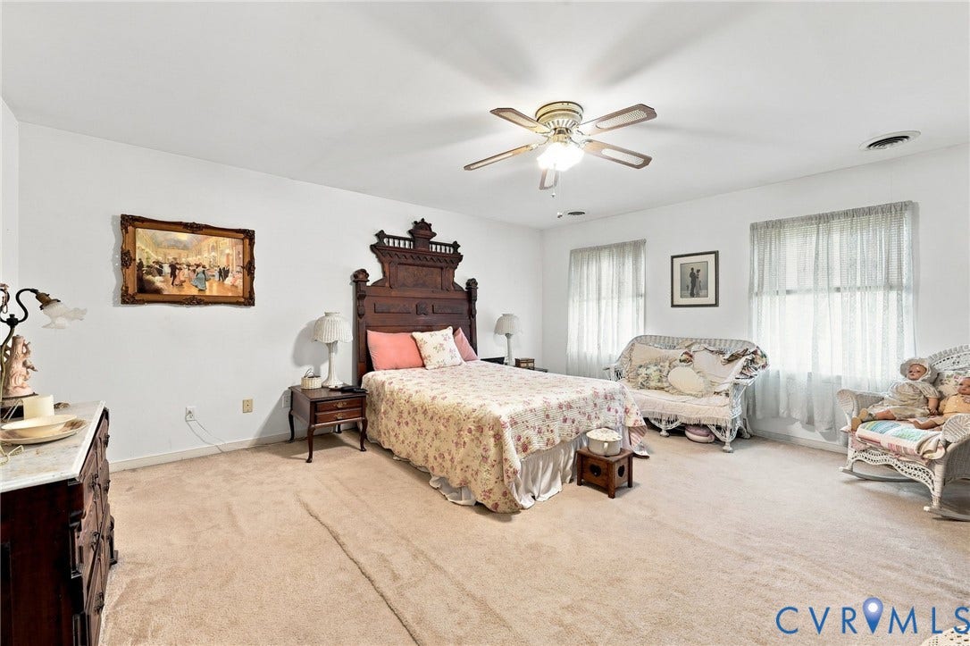3819 Glen Oaks Court, Chester, VA 23831 Spacious bedroom featuring neutral carpeting, white walls, and multiple windows with sheer drapery
