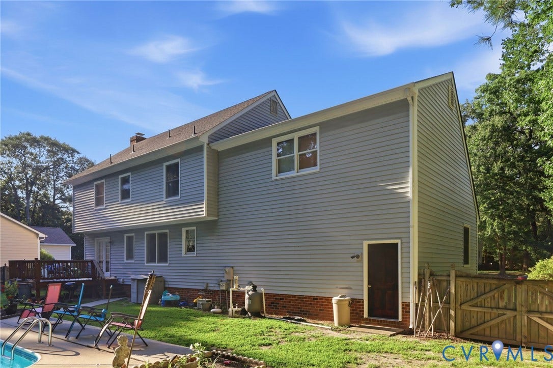 3819 Glen Oaks Court, Chester, VA 23831 Light blue horizontal siding and brick foundation