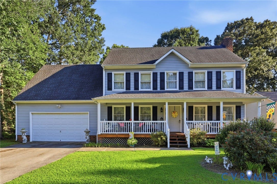 3819 Glen Oaks Court, Chester, VA 23831 Light blue siding exterior with dark shutters, featuring a covered front porch with white vinyl railings and columns