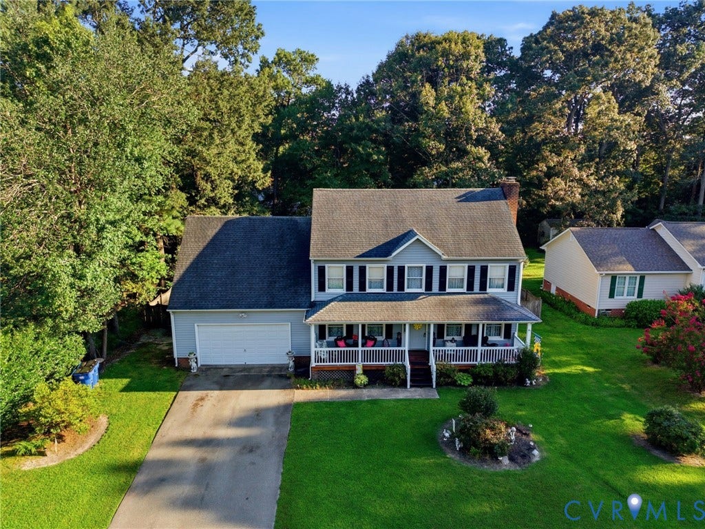 3819 Glen Oaks Court, Chester, VA 23831 Two-story residence featuring a covered front porch, attached garage, and a paved driveway
