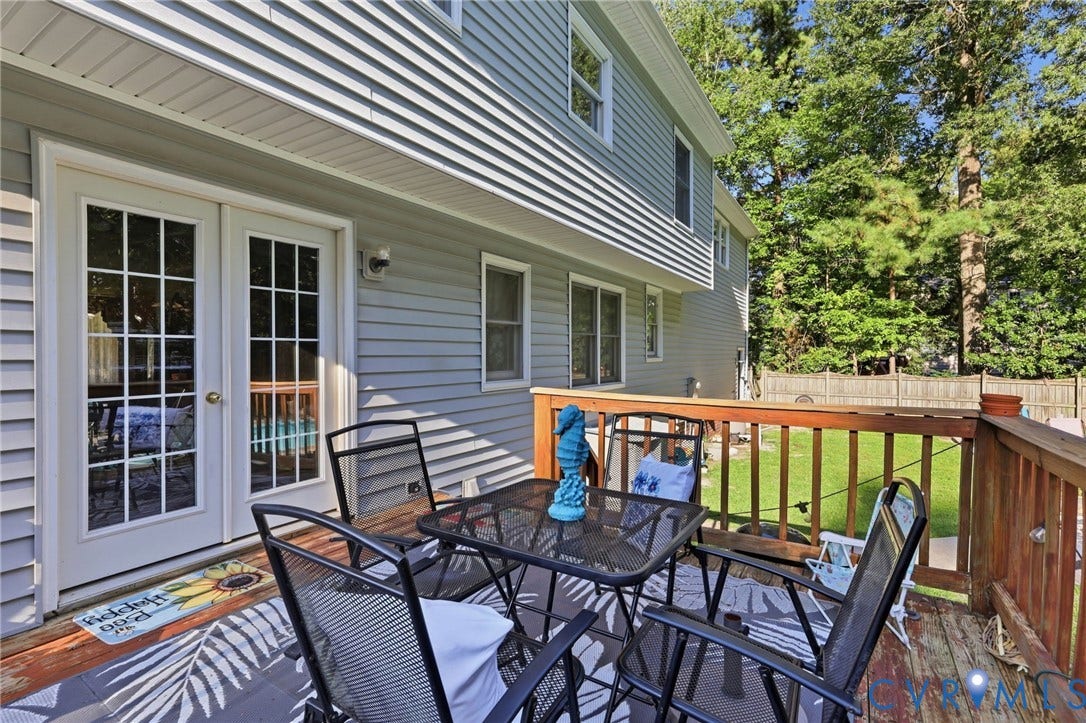 3819 Glen Oaks Court, Chester, VA 23831 Wood-tone deck featuring white French doors with grid-patterned glass