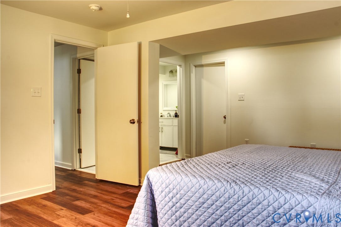 5004 Fairlake Lane, Henrico, VA 23060 Bedroom featuring wood-finish flooring, white baseboards, and neutral wall paint