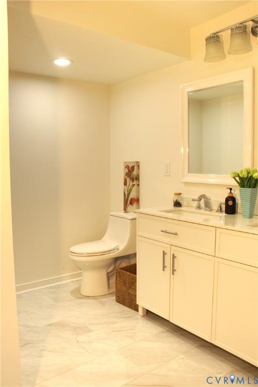 5004 Fairlake Lane, Henrico, VA 23060 Bathroom featuring a white vanity with double cabinet doors and drawers, a white countertop, and a rectangular undermount sink