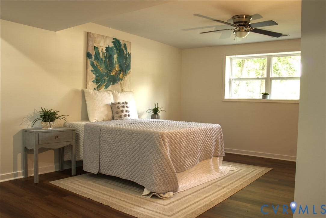 5004 Fairlake Lane, Henrico, VA 23060 Bedroom featuring wood-finish flooring, a ceiling fan with integrated lighting, and a window providing natural illumination