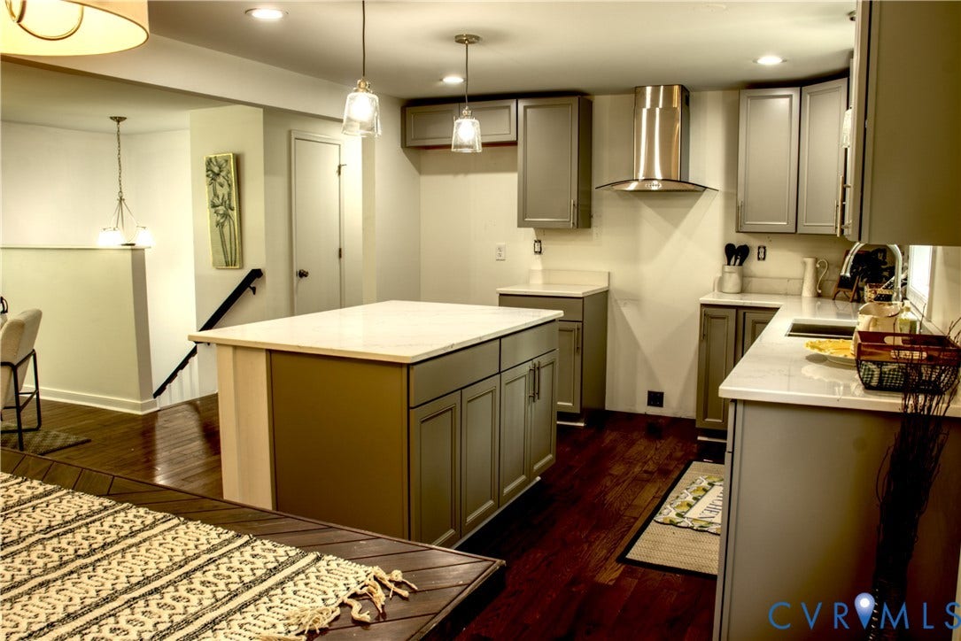 5004 Fairlake Lane, Henrico, VA 23060 Kitchen featuring a central island with countertop, coordinating cabinetry, stainless steel range hood, stainless steel sink with gooseneck faucet, and recessed lighting