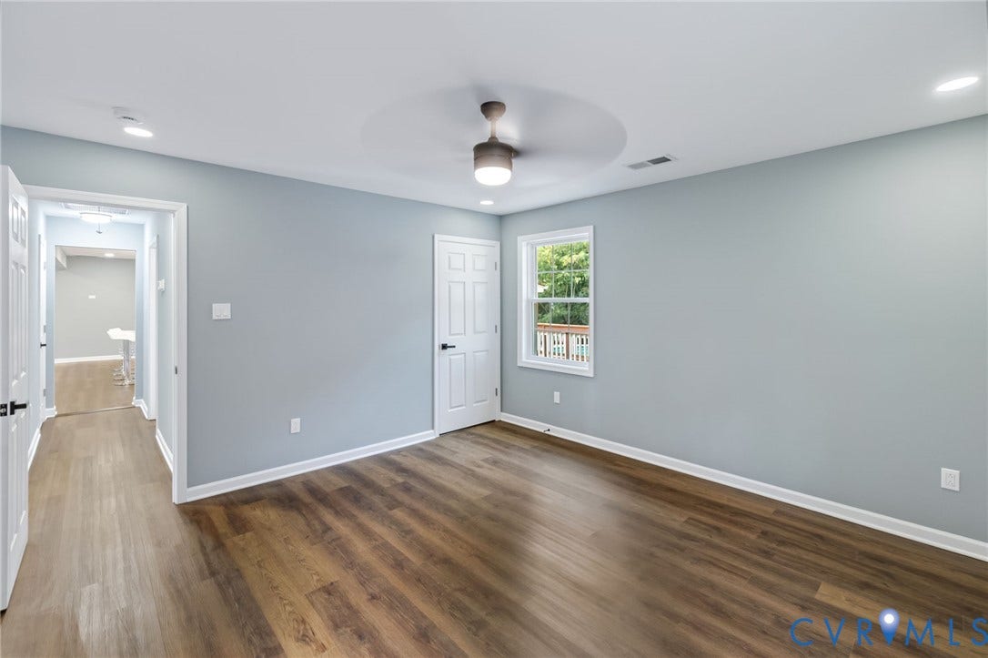 Wood-finish flooring, recessed lighting, and a ceiling fan