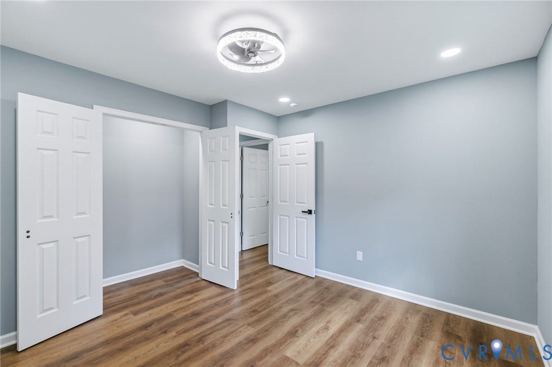 Wood-finish flooring, recessed lighting, and a modern ceiling fan