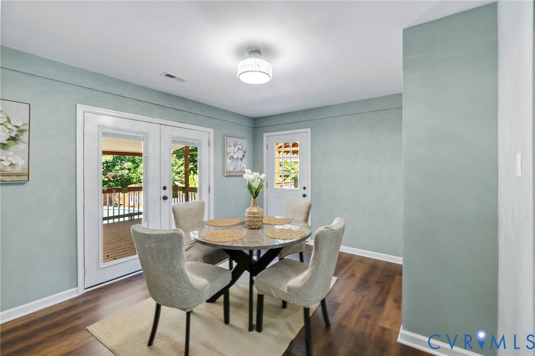 Wood-finish flooring, white baseboards, and a drum ceiling fixture