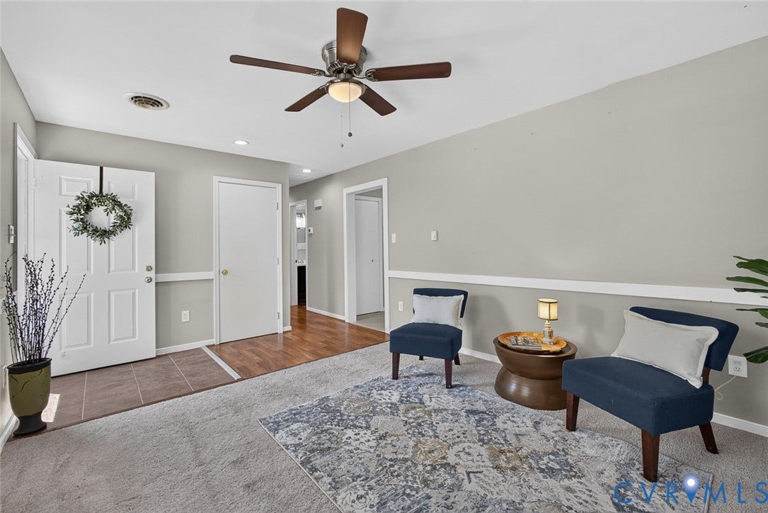 6302 Phobus Court, Richmond, VA 23234 Inviting entry area featuring a white paneled door, ceramic tile flooring, and wood-finish flooring
