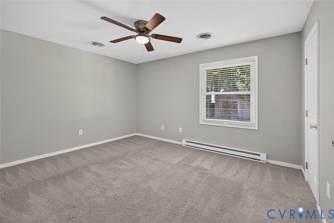 6302 Phobus Court, Richmond, VA 23234 Spacious room featuring neutral carpeting and light gray walls