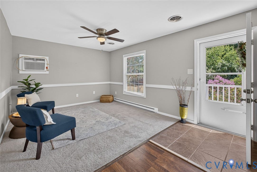 6302 Phobus Court, Richmond, VA 23234 Entryway featuring wood-finish flooring transitioning to carpet, a ceiling fan, baseboard trim, and a window with blinds