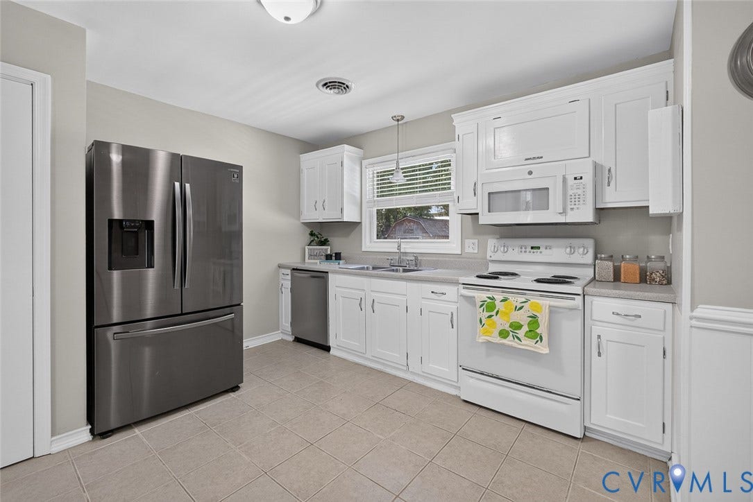 6302 Phobus Court, Richmond, VA 23234 Kitchen featuring white cabinetry, light-toned countertops, and tile flooring
