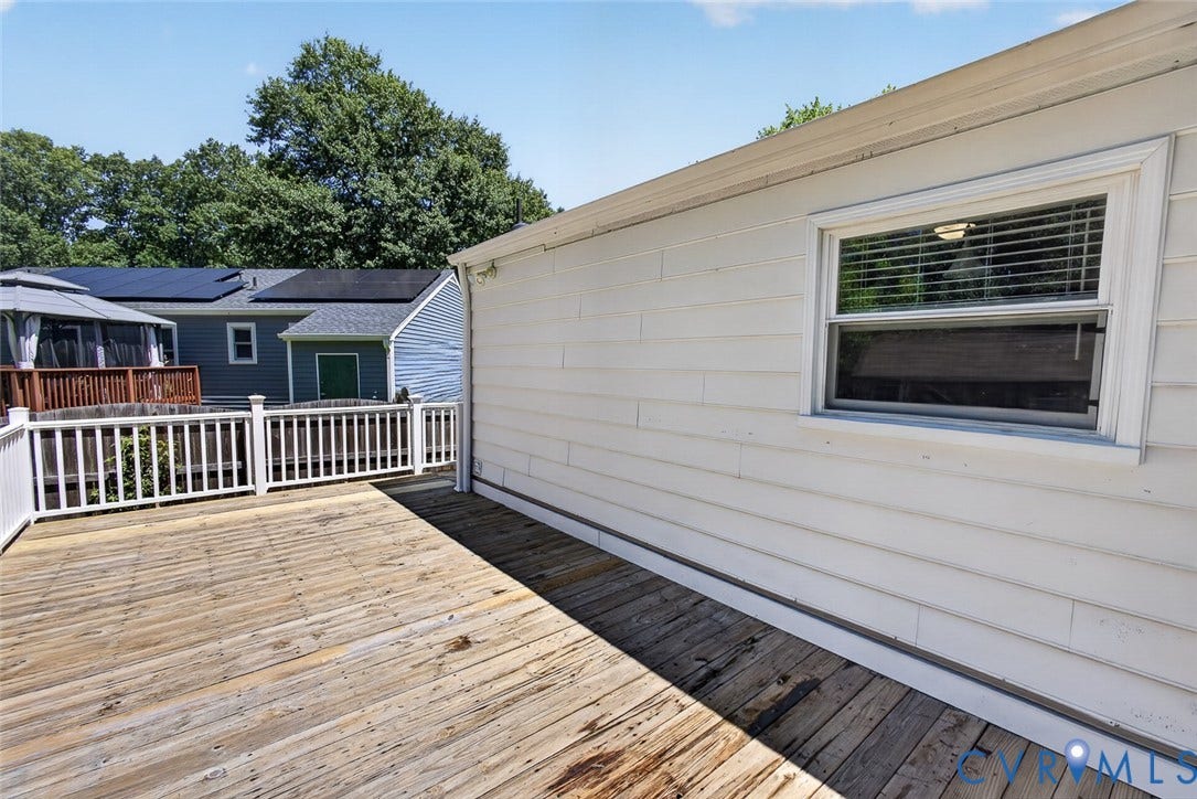 6302 Phobus Court, Richmond, VA 23234 Expansive exterior deck featuring a white railing and natural wood planking