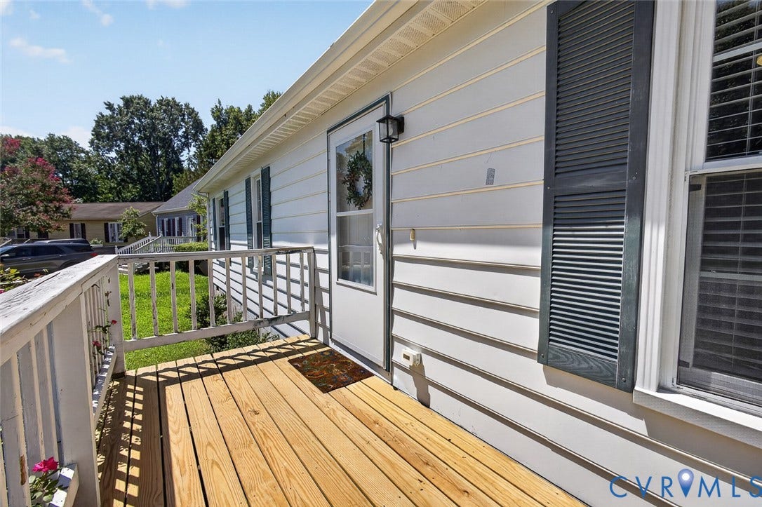 6302 Phobus Court, Richmond, VA 23234 Front entry with a wood deck and white railings
