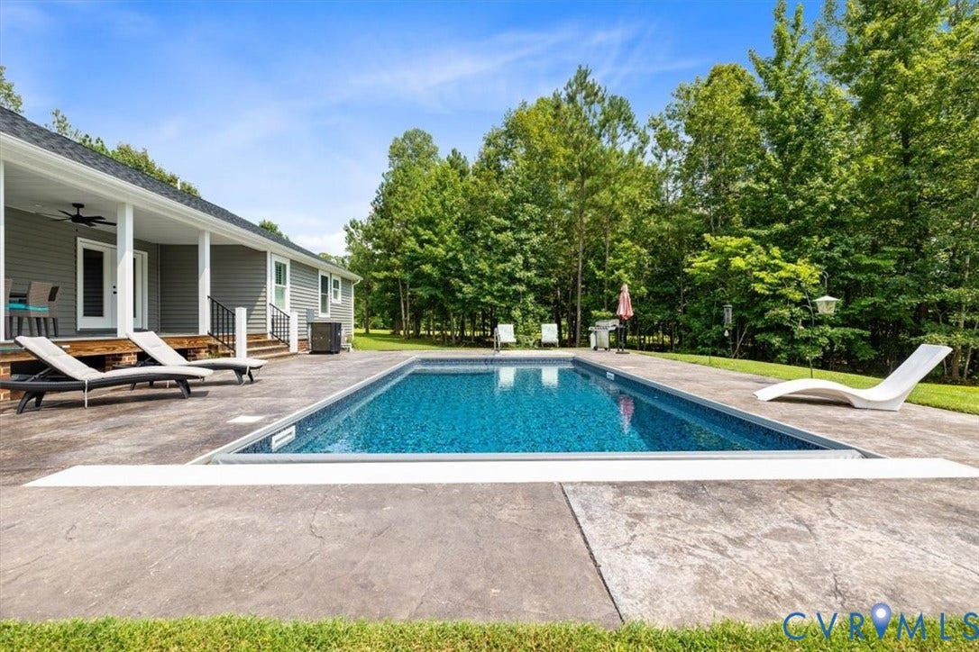 Rectangular inground pool with stamped concrete surround