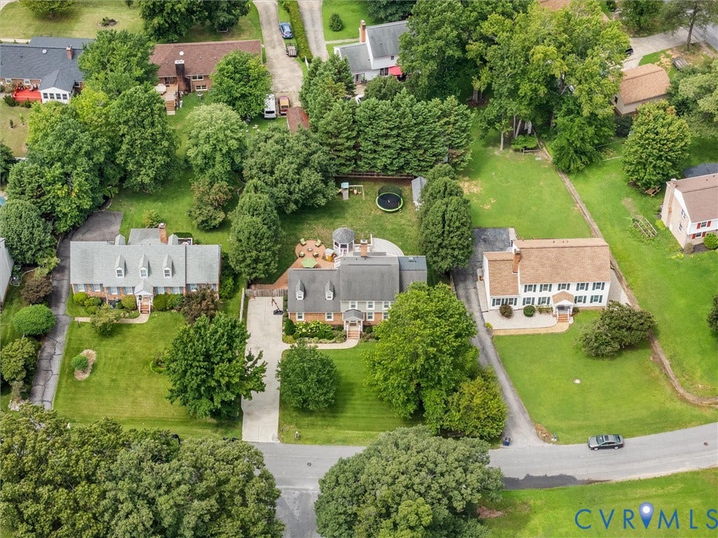 8216 Indian Springs Road, Richmond, VA 23237 Aerial perspective showcasing a residential property with a multi-gabled roof and a paved driveway
