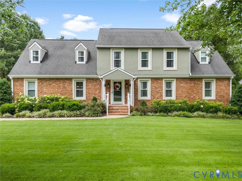 8216 Indian Springs Road, Richmond, VA 23237 Two-story residence featuring a brick first level and light green siding on the second level