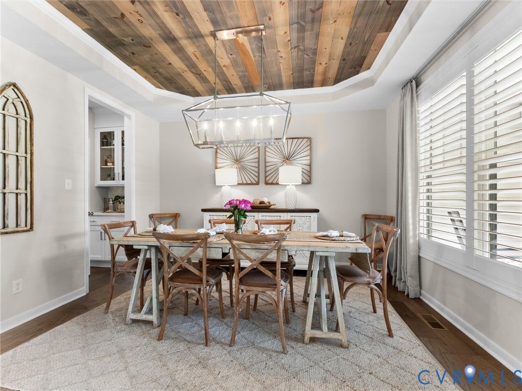 3647 Walkers Creek, Powhatan, VA 23139 Tray ceiling with wood-finish paneling and a geometric chandelier