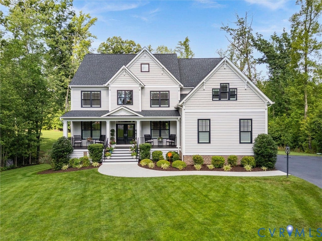 3647 Walkers Creek, Powhatan, VA 23139 Siding exterior with black-framed windows, a covered front porch, and a stone foundation accent