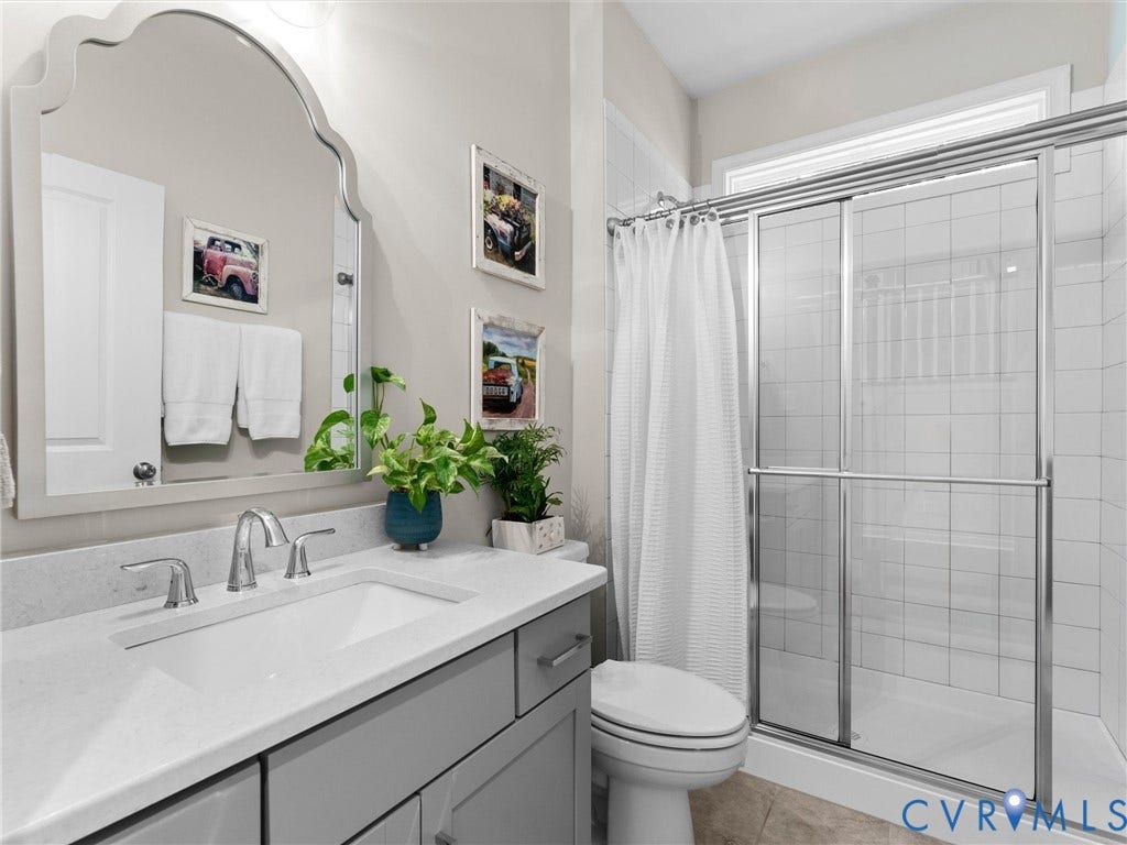 3647 Walkers Creek, Powhatan, VA 23139 Vanity with a light gray countertop, undermount sink, and polished chrome faucet
