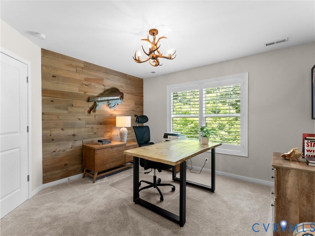 3647 Walkers Creek, Powhatan, VA 23139 Accent wall with horizontal wood paneling, antler-style ceiling light fixture, window with plantation shutters, and light-colored carpet