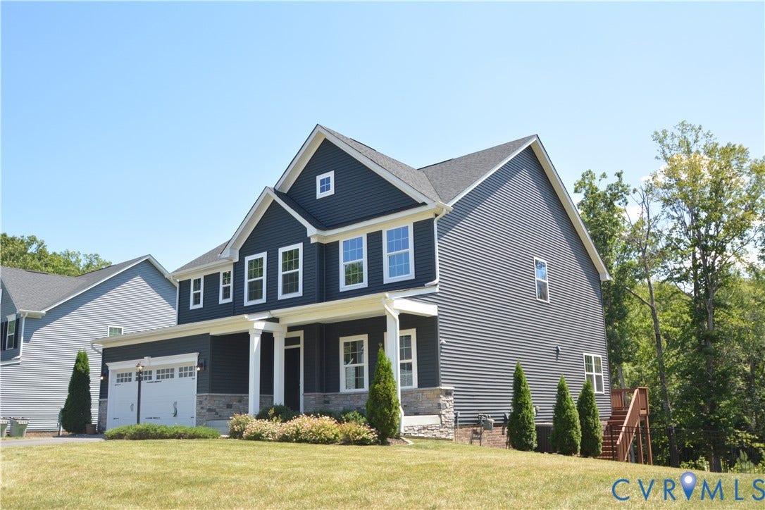 9201 Brett Drive, Bayhill Pointe West, Chesterfield, VA 23112 Two-story residence featuring dark siding with white trim accents