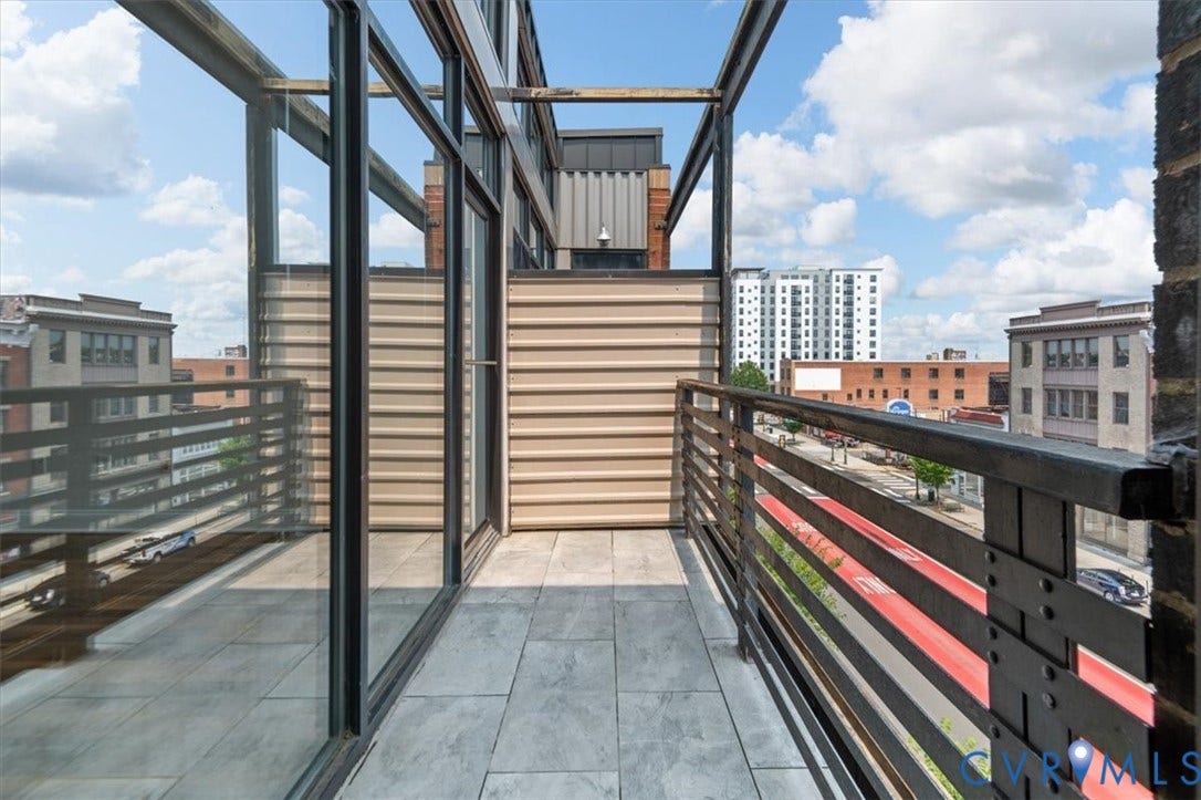 1333 Broad Street, #510, Ironhouse Place Condominiums, Richmond, VA 23220 Private balcony with grey tile flooring and a metal railing