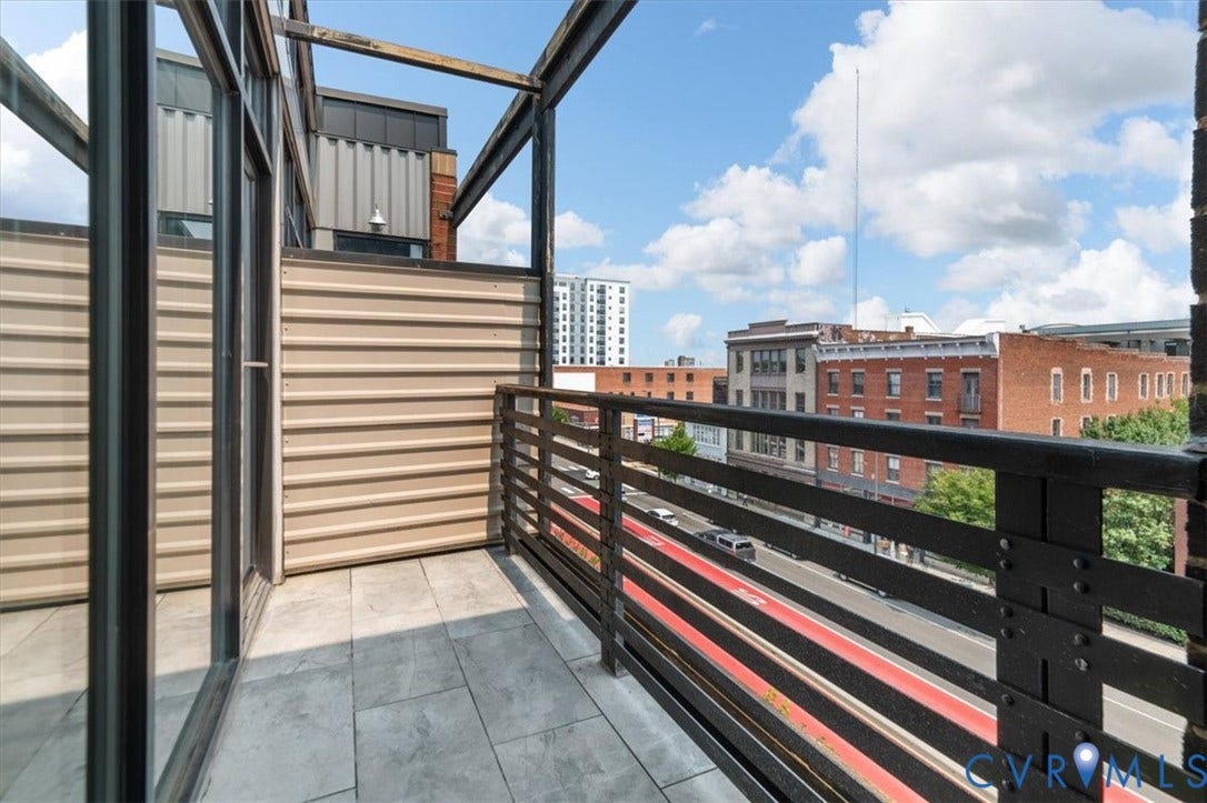 1333 Broad Street, #510, Ironhouse Place Condominiums, Richmond, VA 23220 Private balcony featuring grey tile flooring and a black metal railing