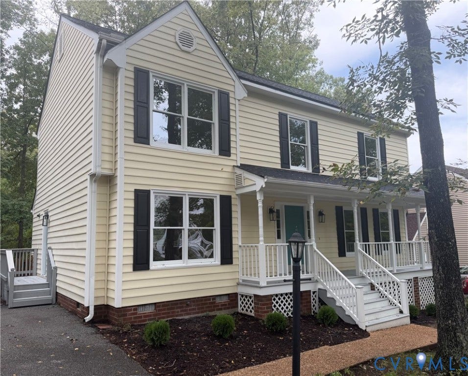 2105 Kelly Ridge Road, Bennington Ridge, Henrico, VA 23233 Two-story exterior with light yellow siding and black shutters