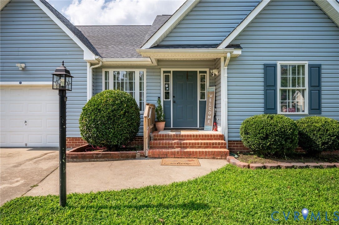 5612 Jessup Station Place, Chesterfield, VA 23234 Light blue siding exterior with dark blue window shutters