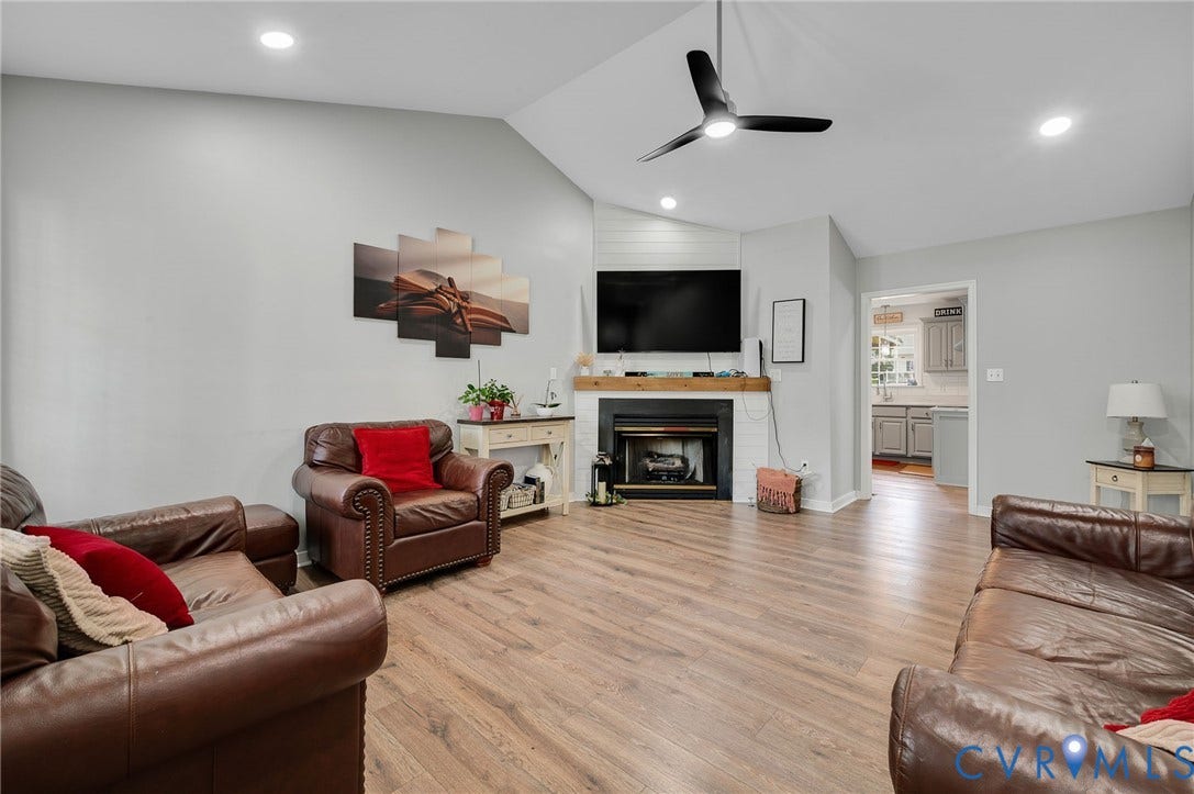 5612 Jessup Station Place, Chesterfield, VA 23234 Spacious living area featuring wood-finish flooring, recessed lighting, and a modern ceiling fan