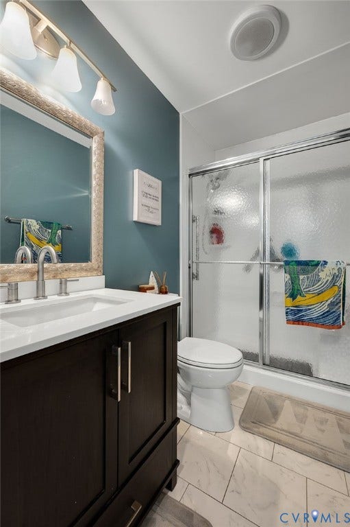 5612 Jessup Station Place, Chesterfield, VA 23234 Spa-inspired ensuite bathroom featuring a teal accent wall, black vanity with chrome hardware, white quartz countertop, and frameless glass shower enclosure with tile surround