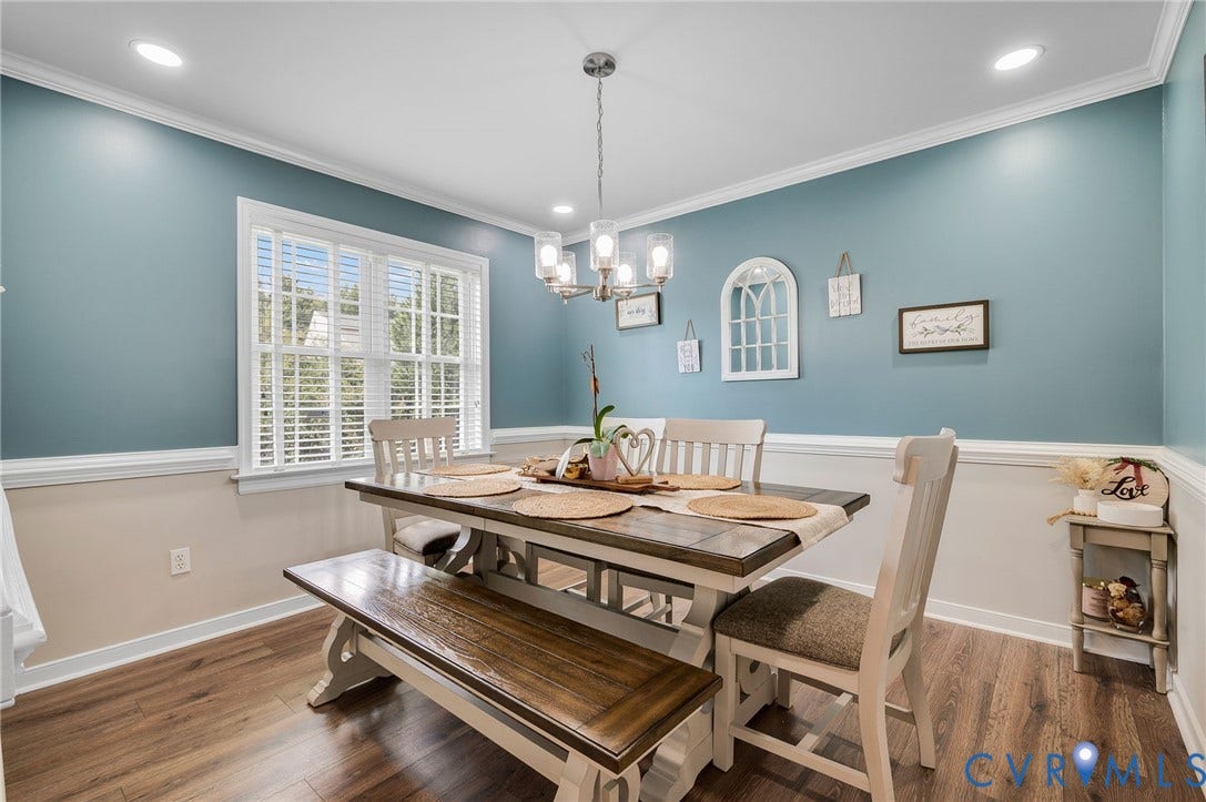 5612 Jessup Station Place, Chesterfield, VA 23234 Dining area featuring wood-finish flooring and a contemporary chandelier