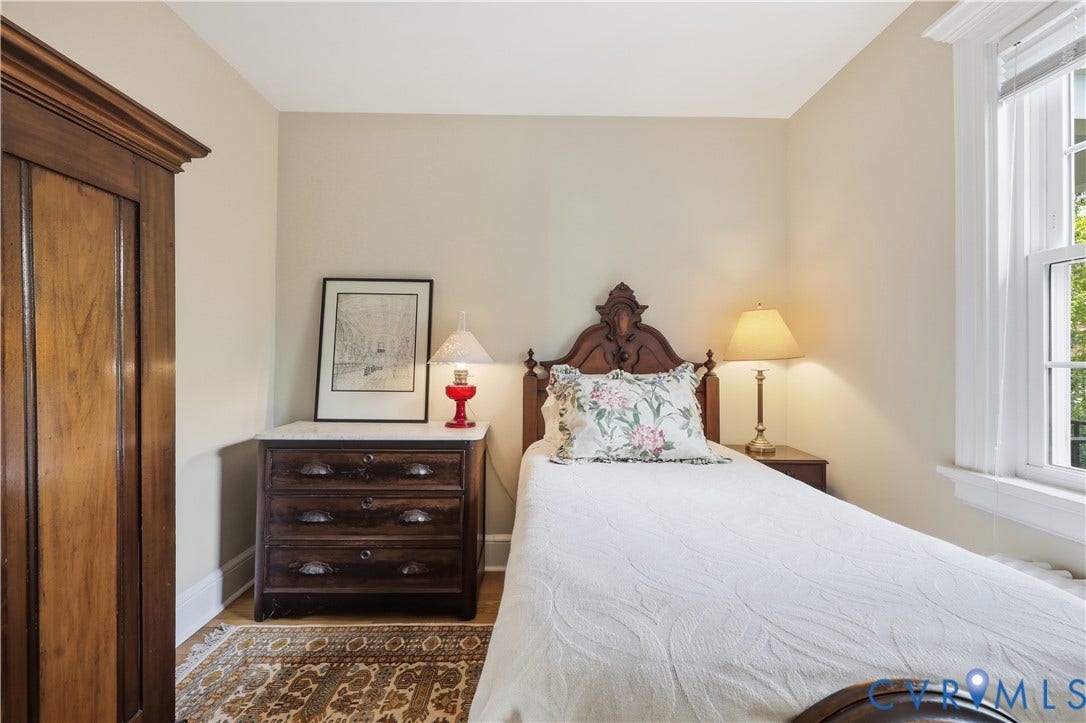 4207 W Grace Street, Sauer's Gardens, Richmond, VA 23230 Room featuring light-toned walls, hardwood flooring, and a large window with white trim