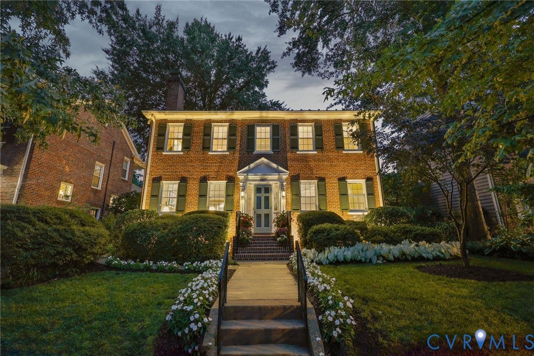 4207 W Grace Street, Sauer's Gardens, Richmond, VA 23230 Brick exterior with green shutter accents, symmetrical window placement, and a covered portico entrance