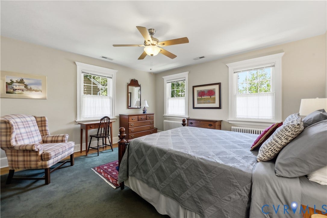4207 W Grace Street, Sauer's Gardens, Richmond, VA 23230 Spacious room featuring three windows with white trim, a ceiling fan with integrated lighting, and wall-to-wall carpeting