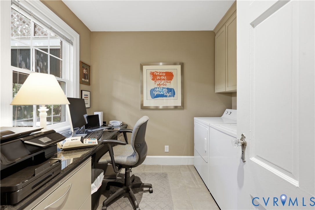 4207 W Grace Street, Sauer's Gardens, Richmond, VA 23230 Dedicated workspace featuring a built-in granite-finish desk, ample natural light from a multi-pane window, and tile flooring