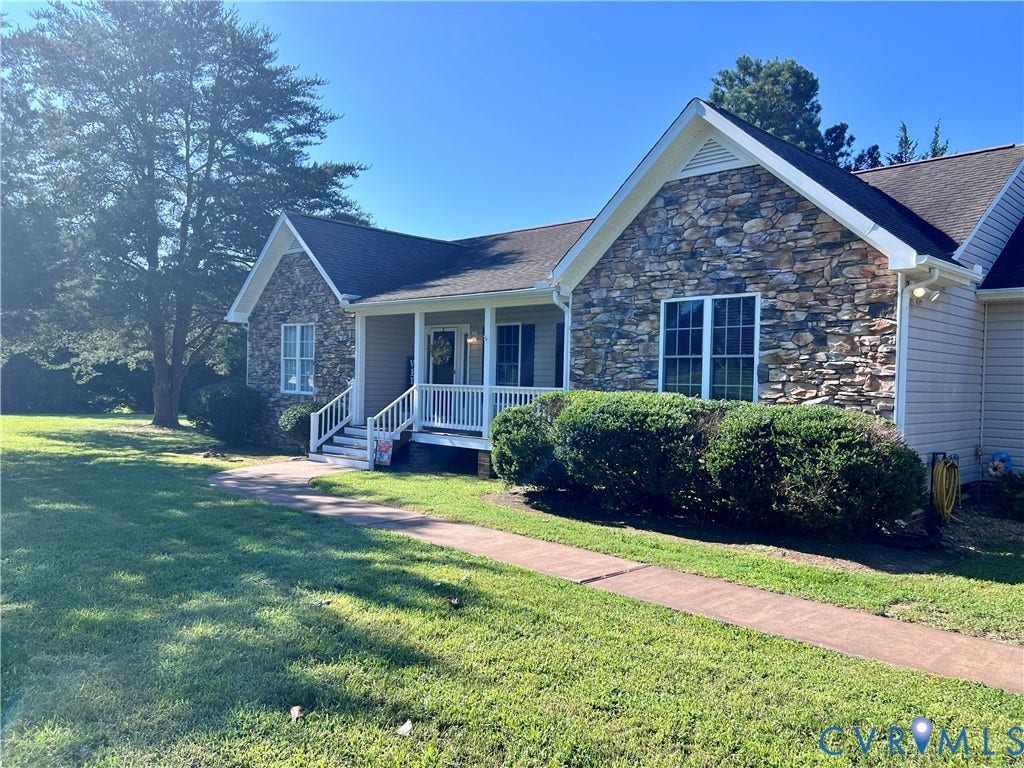 2301 Graceland Drive, Powhatan, VA 23139 Stone and siding exterior with a covered front porch featuring white railings