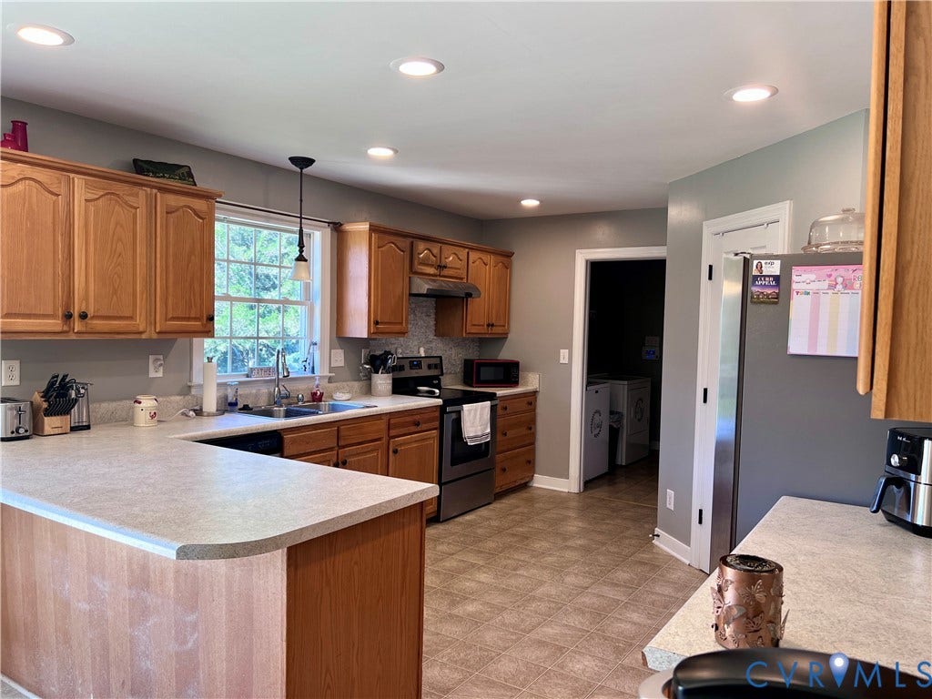 2301 Graceland Drive, Powhatan, VA 23139 Kitchen featuring wood cabinetry, light-colored countertops, stainless steel appliances, and recessed lighting